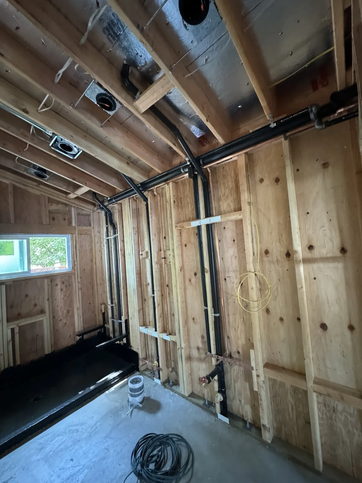 ADU bath: rough plumbing and waterproofed shower pan