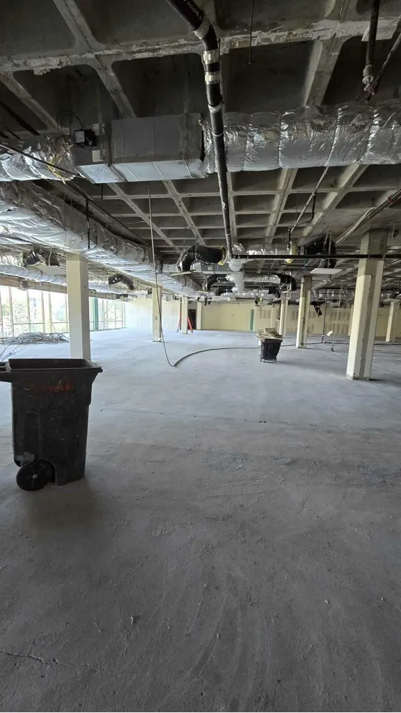 Suite opened to the deck: ductwork and services exposed